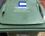 A photo of a North Somerset Council garden waste bin with a 2022-23 permit attached.
