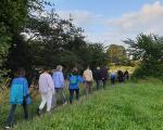 a group walking through a field