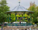 A photo of Grove Park in Weston-super-Mare taken when an event was taking place. People are in the park enjoying entertainment in the bandstand