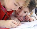 Two children drawing