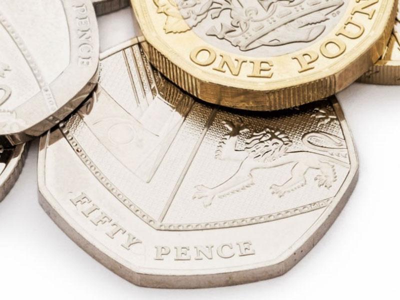 British coins on a white surface