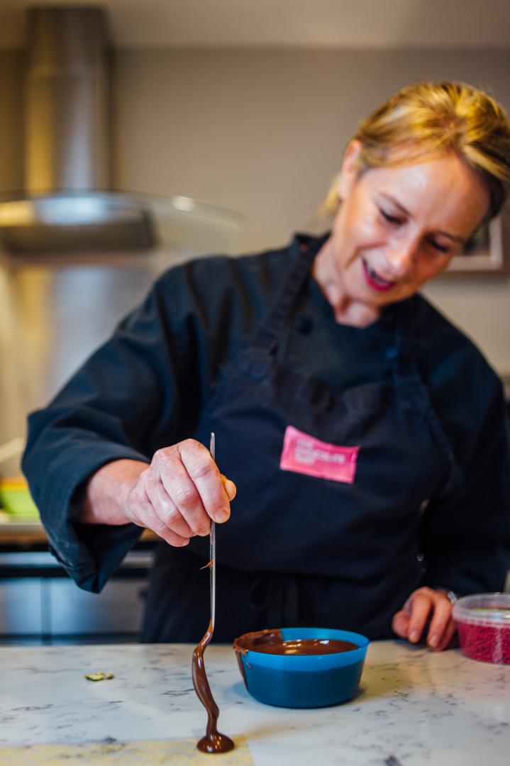 A photo of Lisa Clarke, owner of The Chocolate Tart in Clevedon, at work