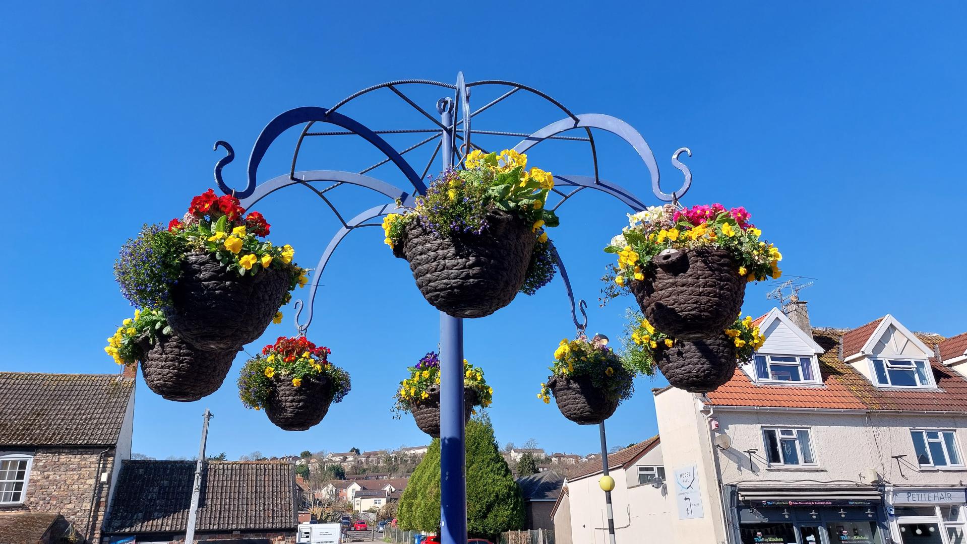 A photo of hanging baskets floral display in Portishead.