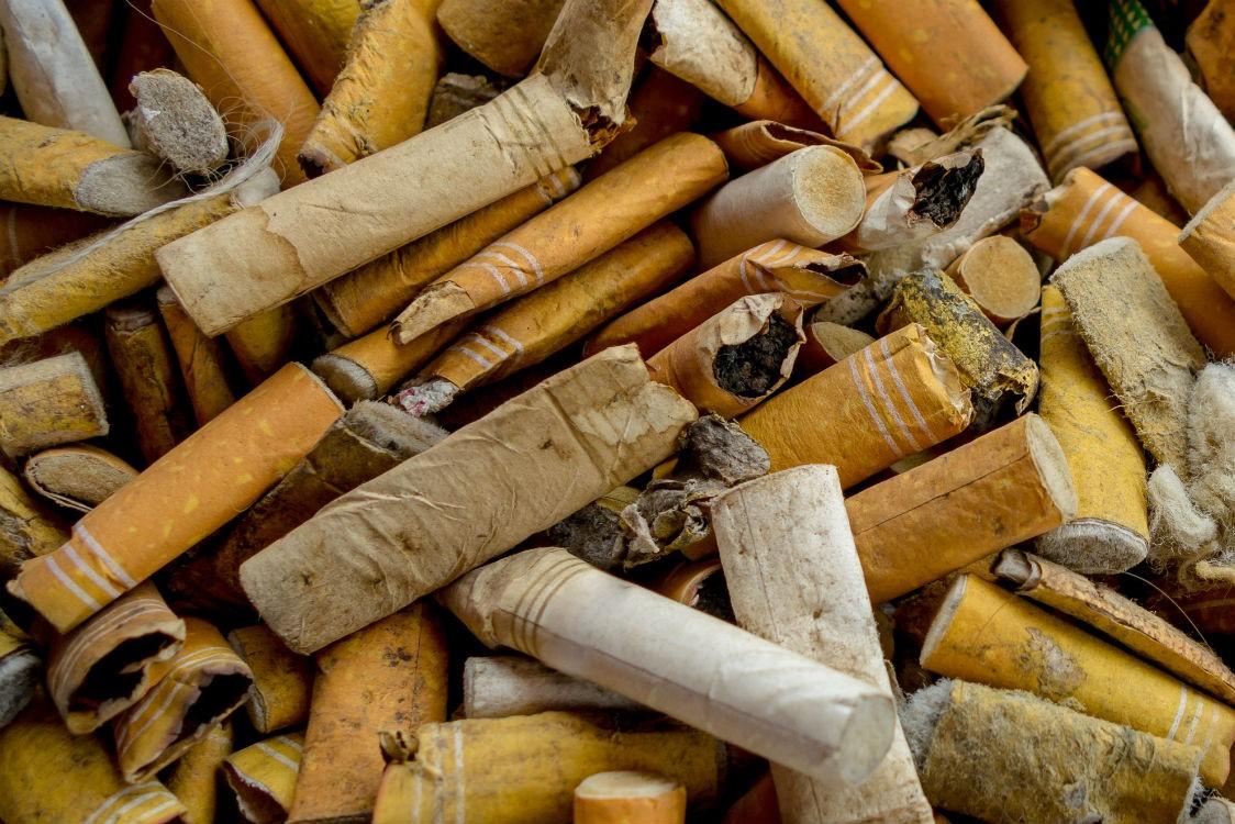 Close up of lots of cigarette ends