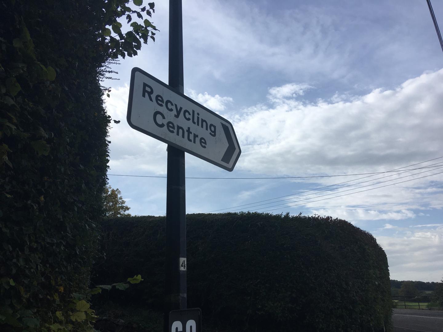 A photo of a direction road sign pointing towards Backwell Recycling Centre