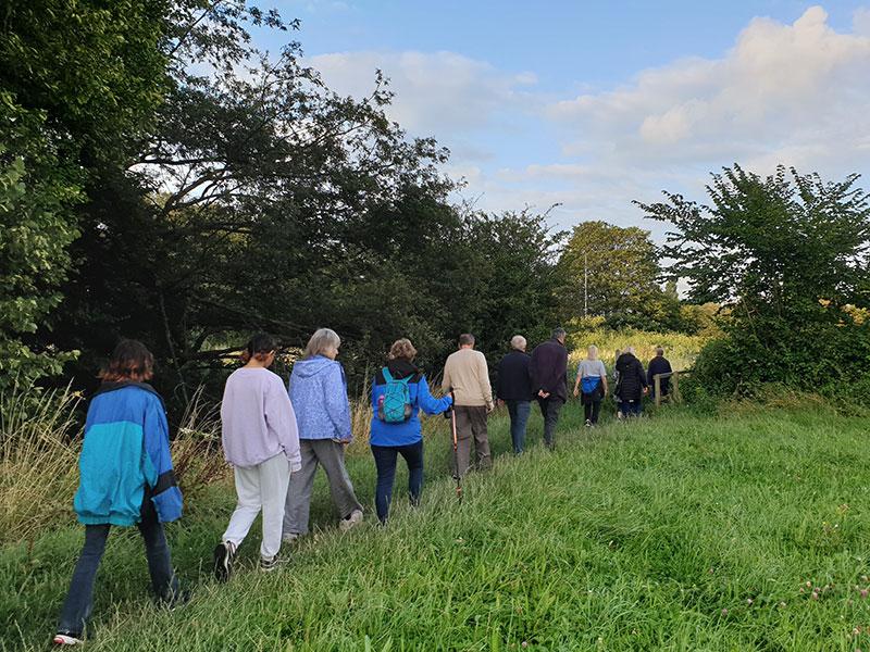 a group walking through a field