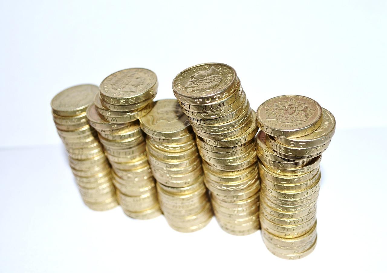 Pound coins precariously balanced