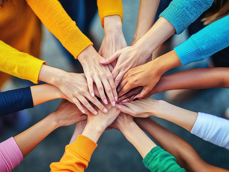 Hands joining together