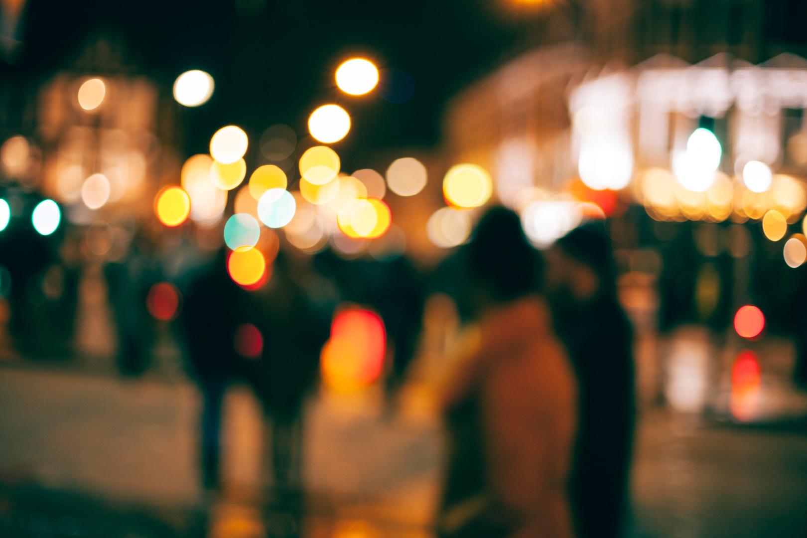 Street scene at night with blurred lights