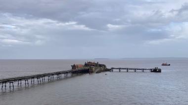 A photo of Birnbeck Island taken from the promenade at high tide with the first boats taking suppliers and workers 8 October 2024